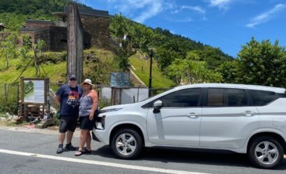 Private car transfer from Hoi An to Phong Nha with scenic stops at Marble Mountains, Hai Van Pass, and Central Vietnam landscapes.