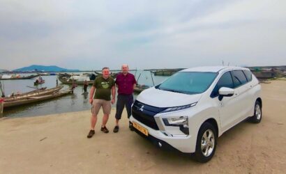 Private car transfer from Hue to Phong Nha with scenic stops at La Vang Holy Land, Hien Luong Bridge, and Central Vietnam landscapes.