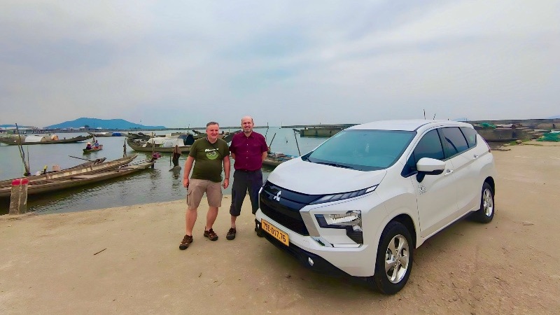 Private car transfer from Hue to Phong Nha with scenic stops at La Vang Holy Land, Hien Luong Bridge, and Central Vietnam landscapes.