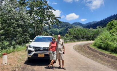 Private car transfer from Phong Nha to Hue with scenic stops at La Vang Holy Land and Hien Luong Bridge in Central Vietnam.