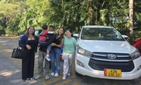 Airport pickup service in Phong Nha with a private driver welcoming travelers for a comfortable transfer from Dong Hoi Airport.